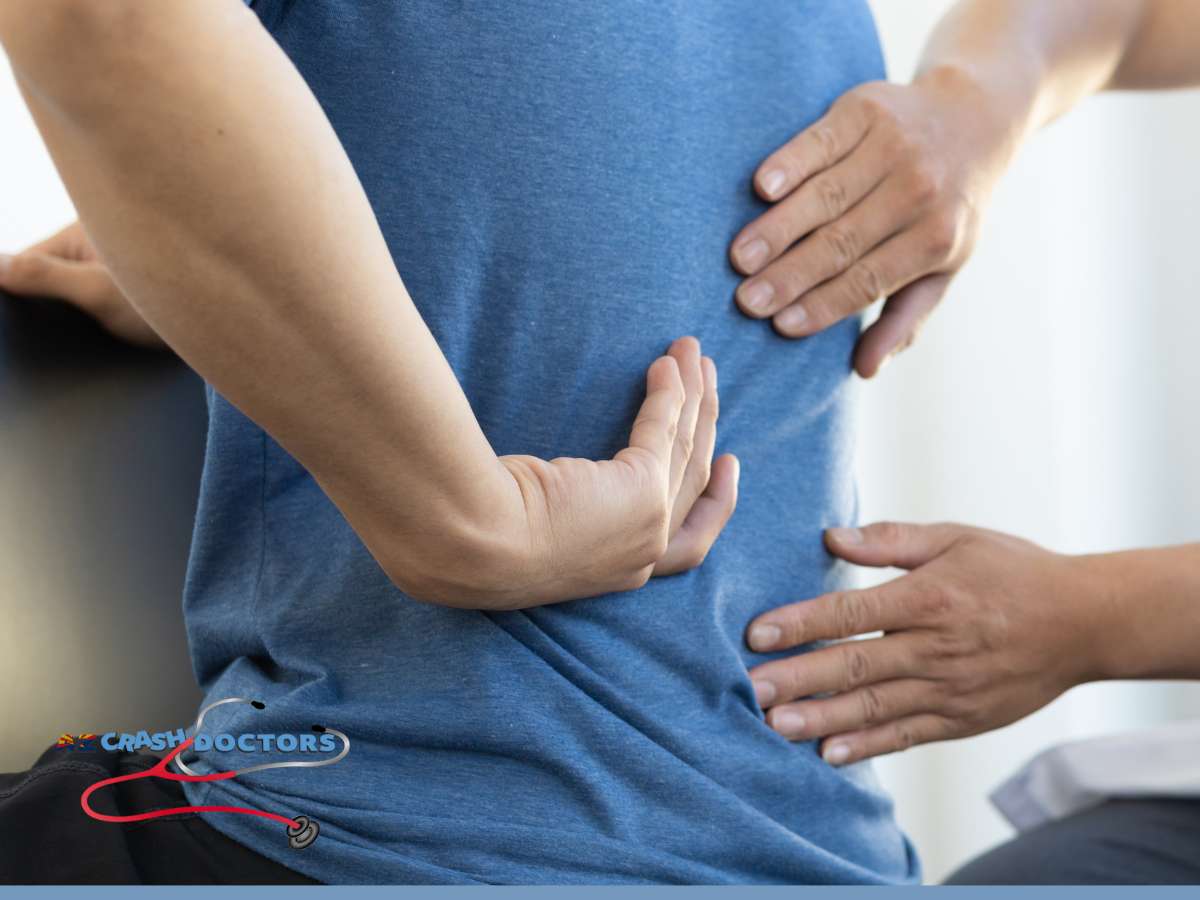 Chiropractor treating Herniated Disc Pain After a Car Accident at AZ Crash Doctors clinic.