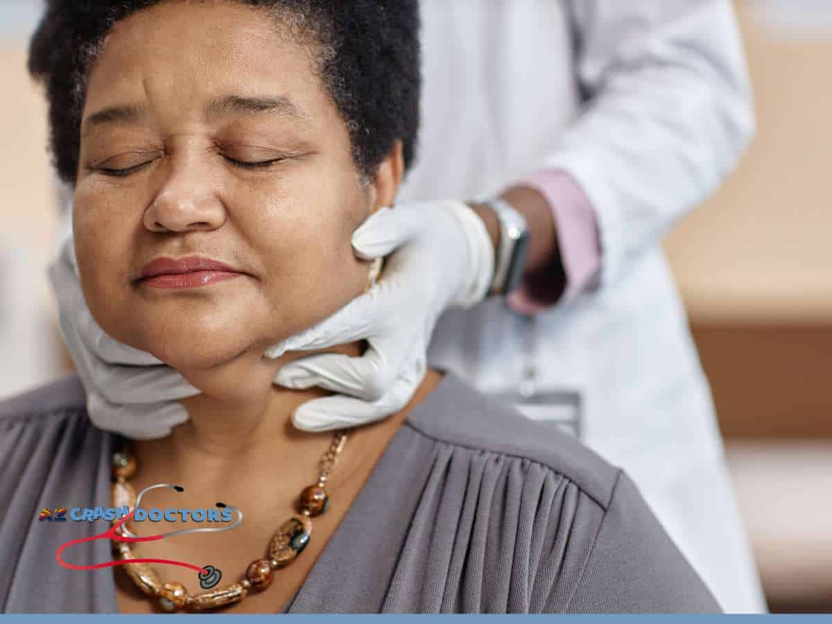 Chiropractor examining a patient’s neck for Facial Nerve Pain after a car accident.