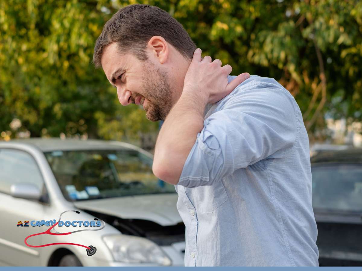 A man in Arizona clutching his neck in pain, standing in front of a car, indicative of the need for pain management